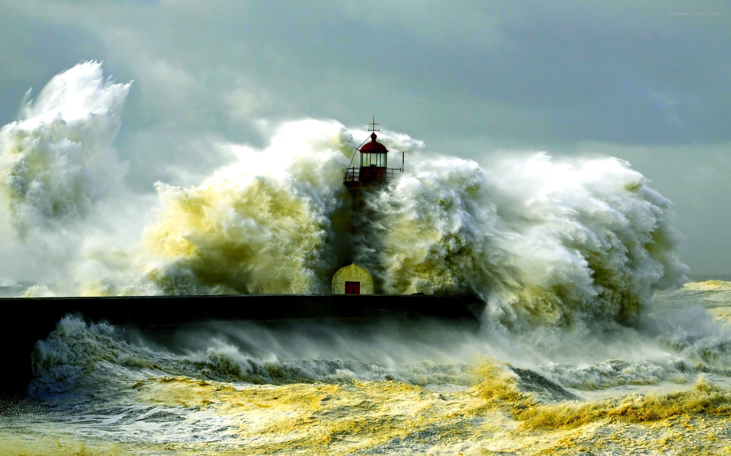 Lighthouse in stormy waves