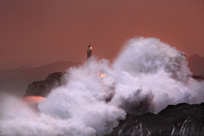 Lighthouse in stormy waves