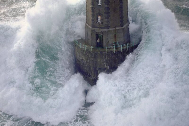 Lighthouse in stormy waves