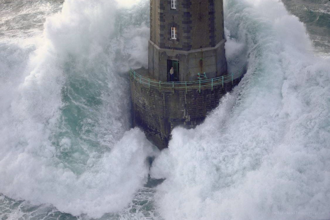Lighthouse in stormy waves