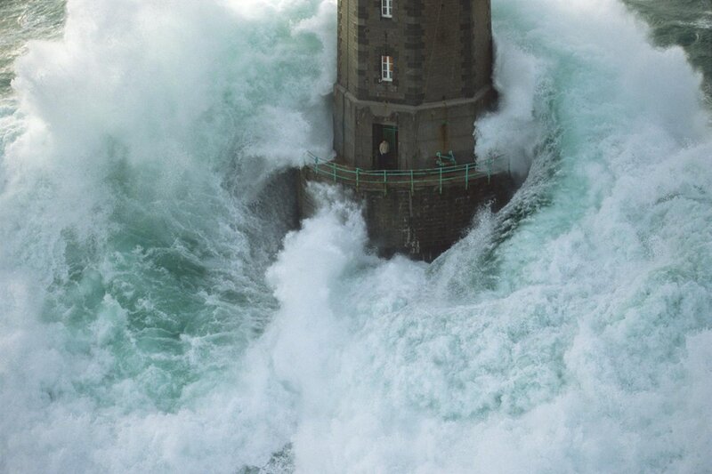 Lighthouse in stormy waves