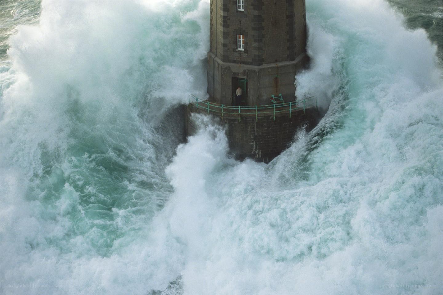 Lighthouse in stormy waves