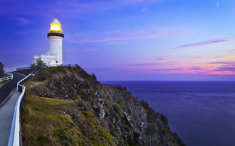 Lighthouse on a cliff at dusk