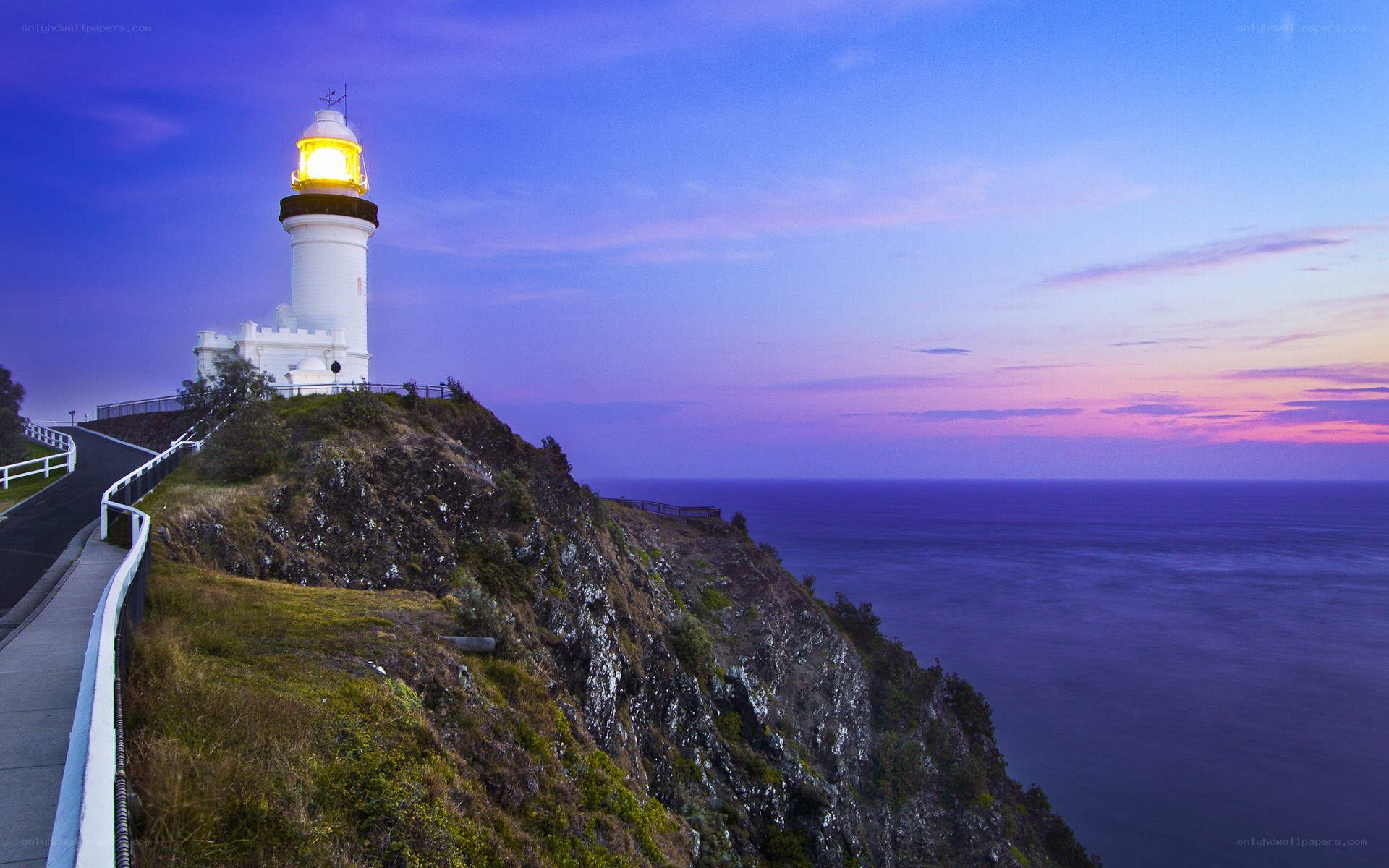 Lighthouse on a cliff at dusk
