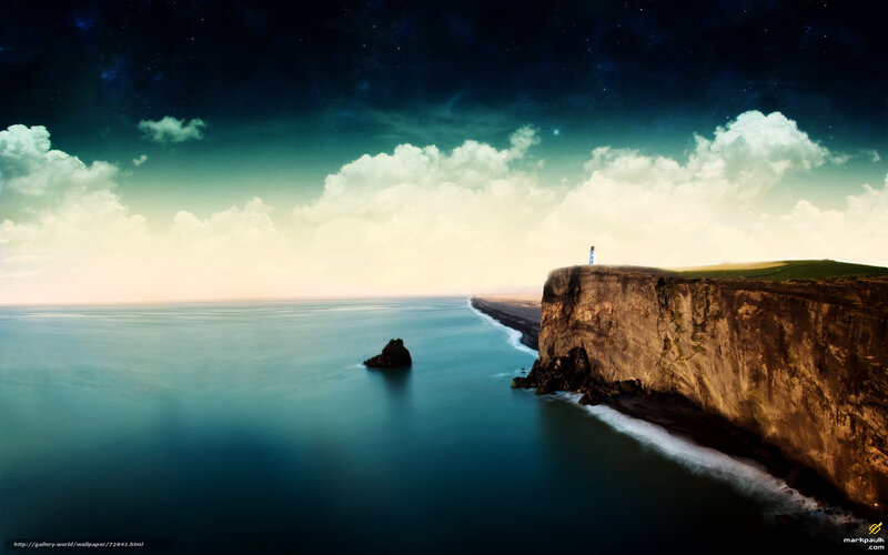 Lighthouse on a cliff at night