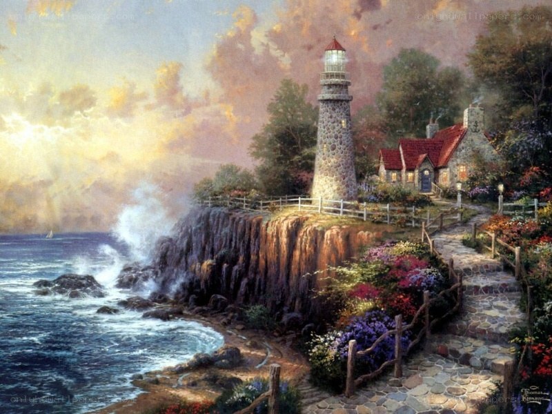 Lighthouse on a cliff at sunset