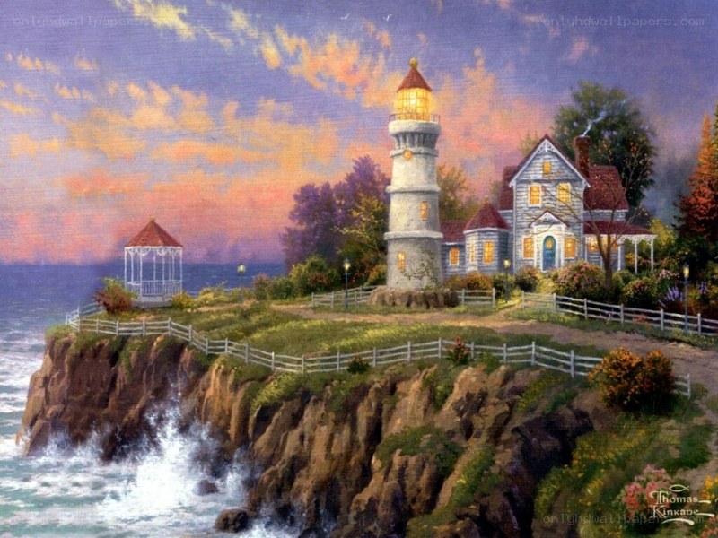 Lighthouse on a cliff at sunset