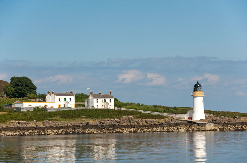 Lighthouse on a Coastal Island — Blue