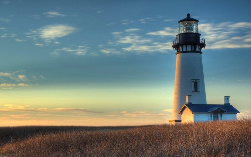 Lighthouse on a Dune — Blue, Serene, Sunset