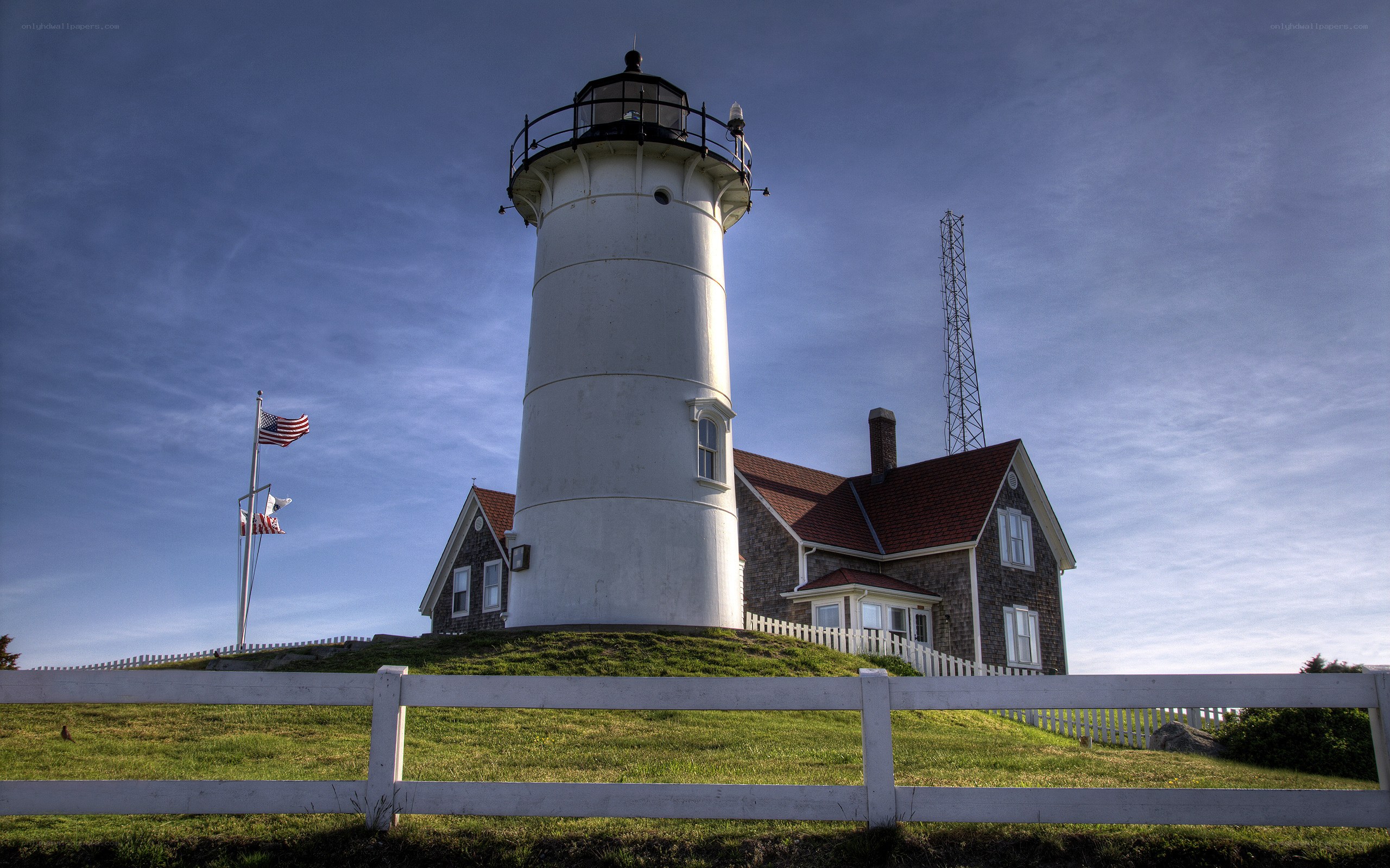 Lighthouse on a grassy hill