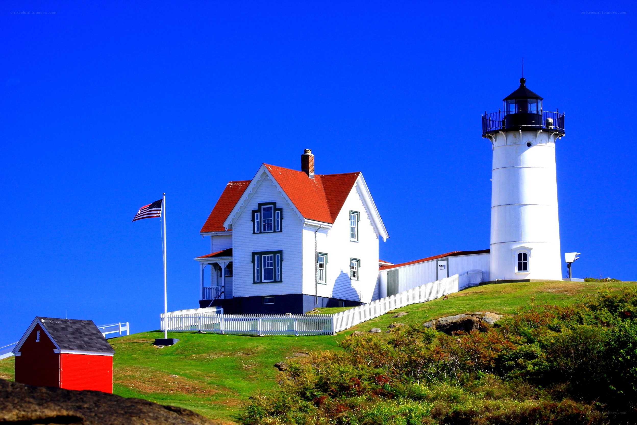 Lighthouse on a grassy hill