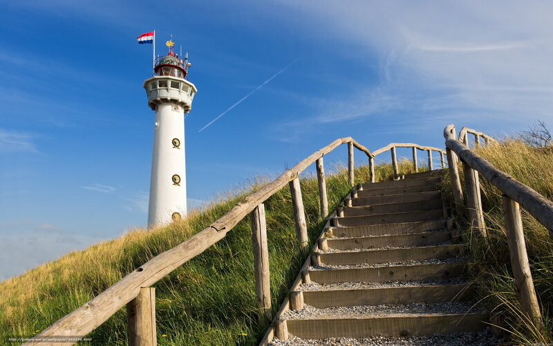 Lighthouse on a grassy hill