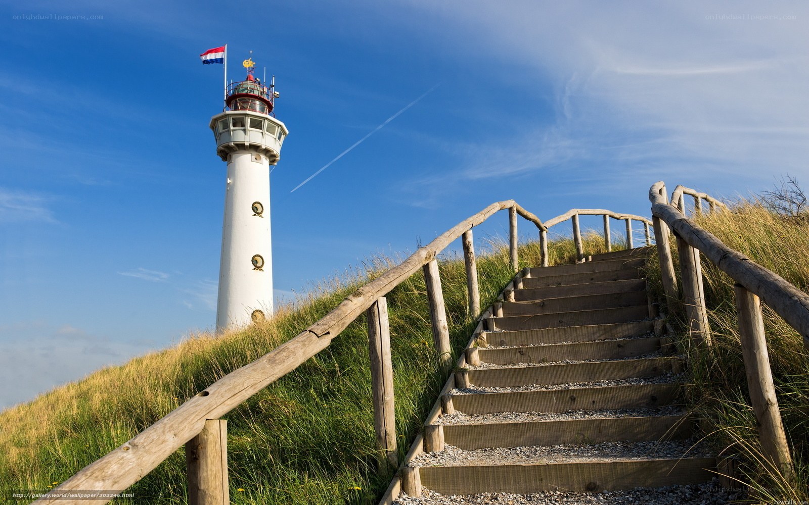 Lighthouse on a grassy hill