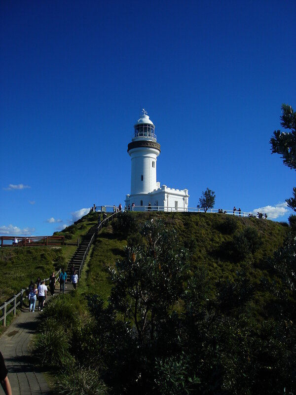 lighthouse on a grassy hill