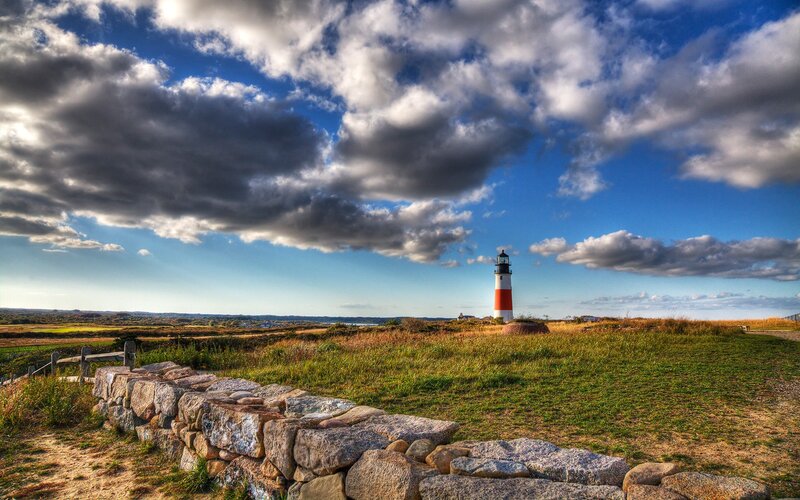 Lighthouse on a grassy hill