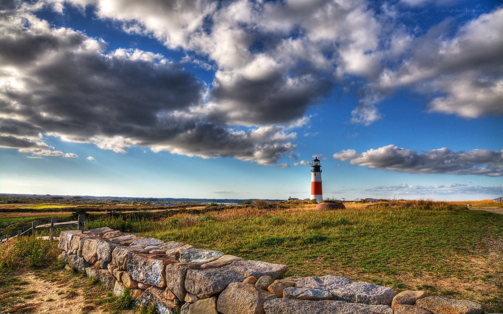 Lighthouse on a grassy hill