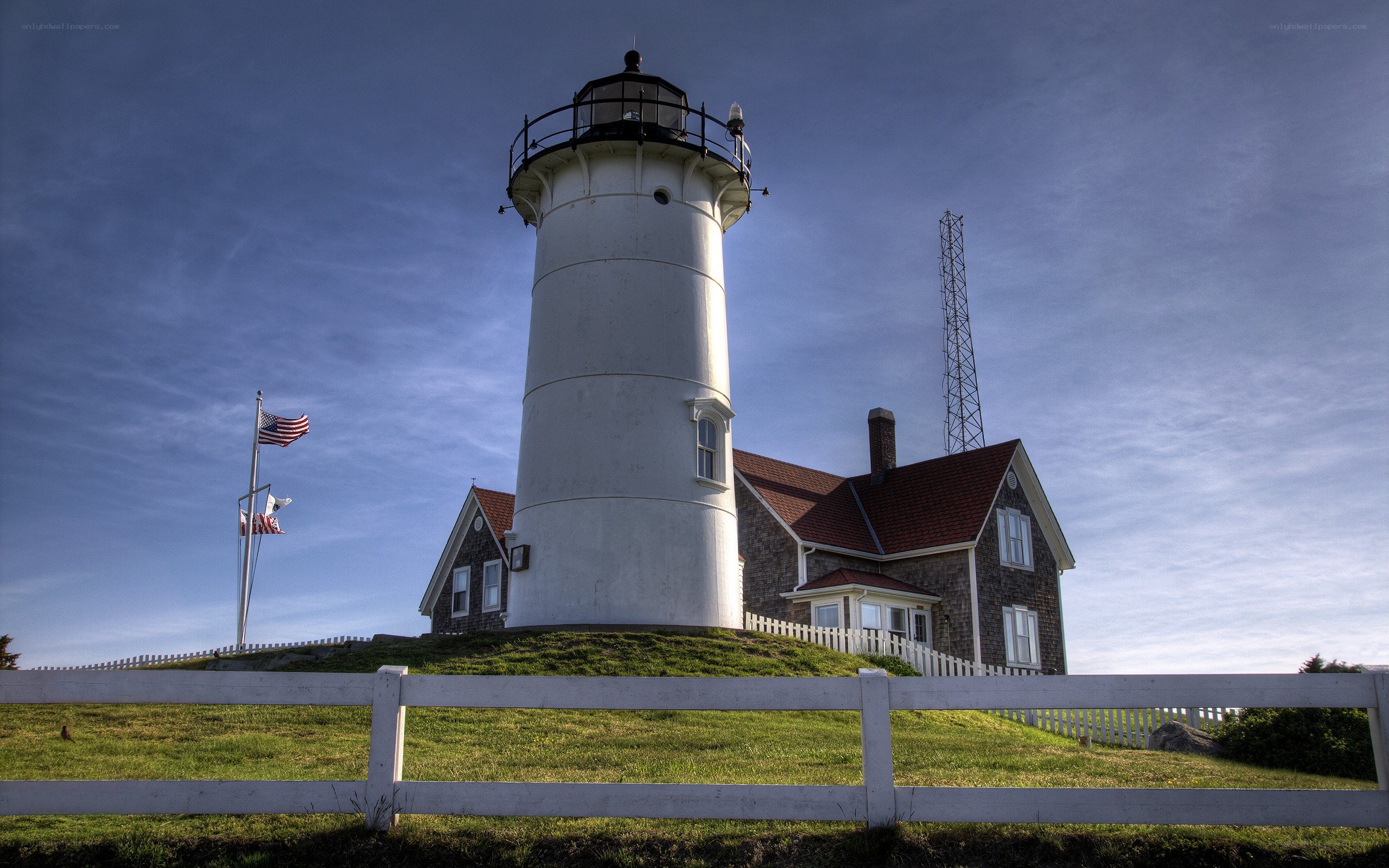 Lighthouse on a grassy hill