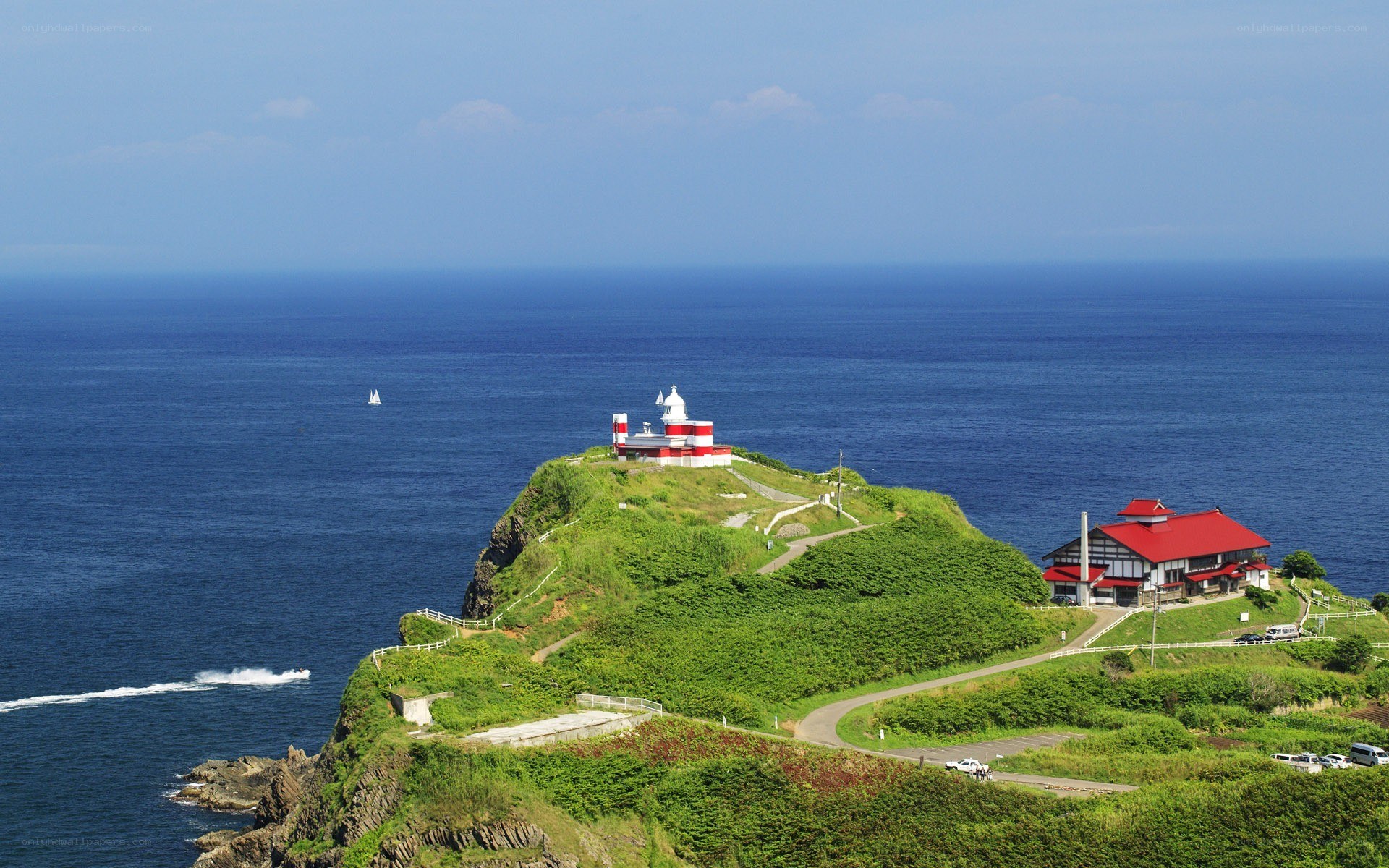Lighthouse on a green cliff