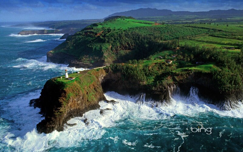 lighthouse on a green cliff