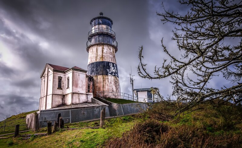 Lighthouse on a Hill — Gray, Dramatic, Photograph