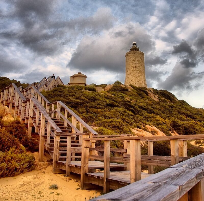 Lighthouse on a hill with wooden stairs