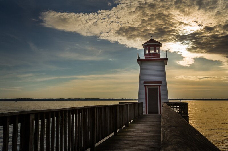 Lighthouse on a Pier — Blue, Dramatic, Sunset, Photograph, Water