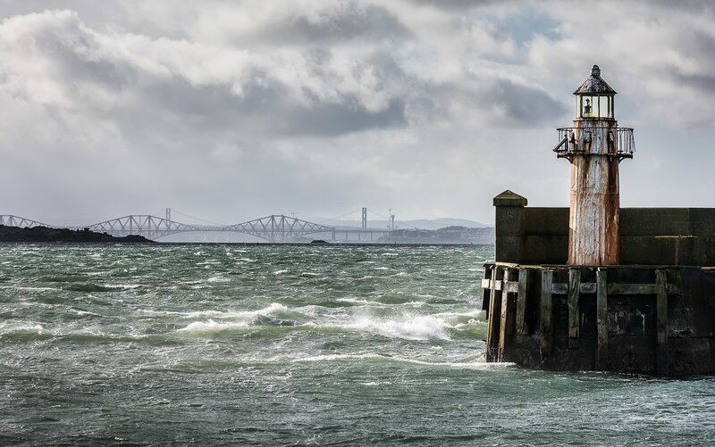 Lighthouse on a Pier — Gray, Dramatic, Photograph