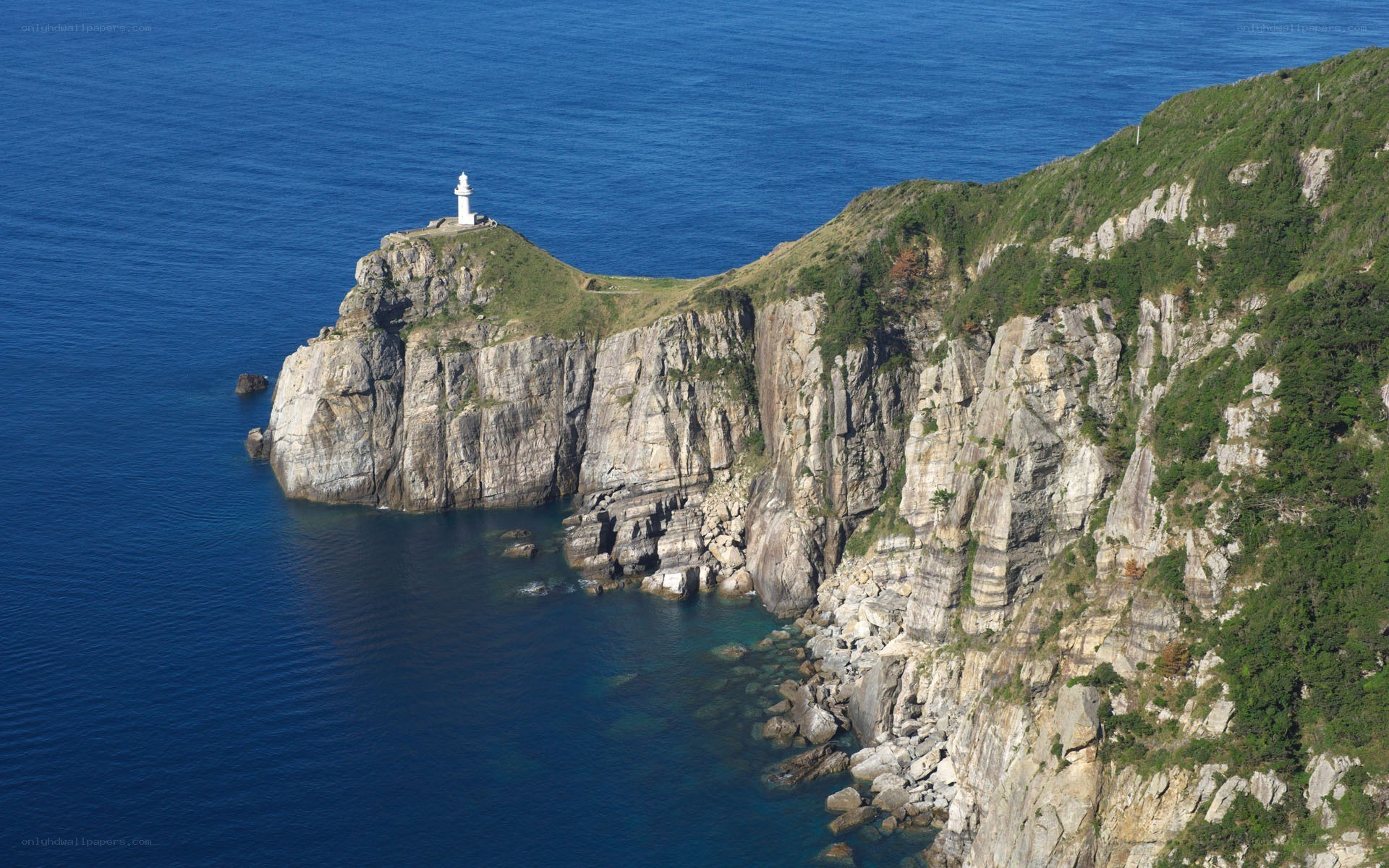 Lighthouse on a rocky cliff