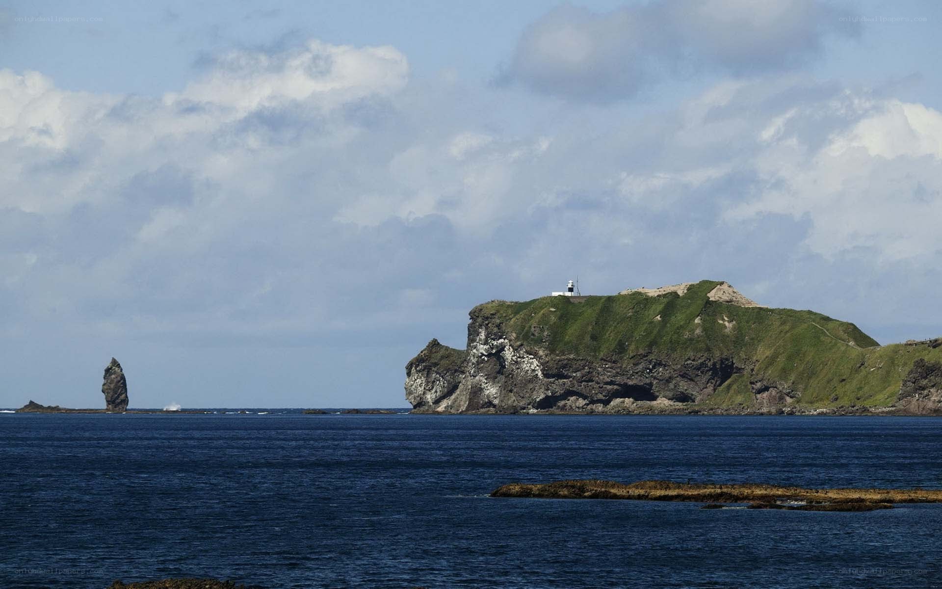 Lighthouse on a rocky island