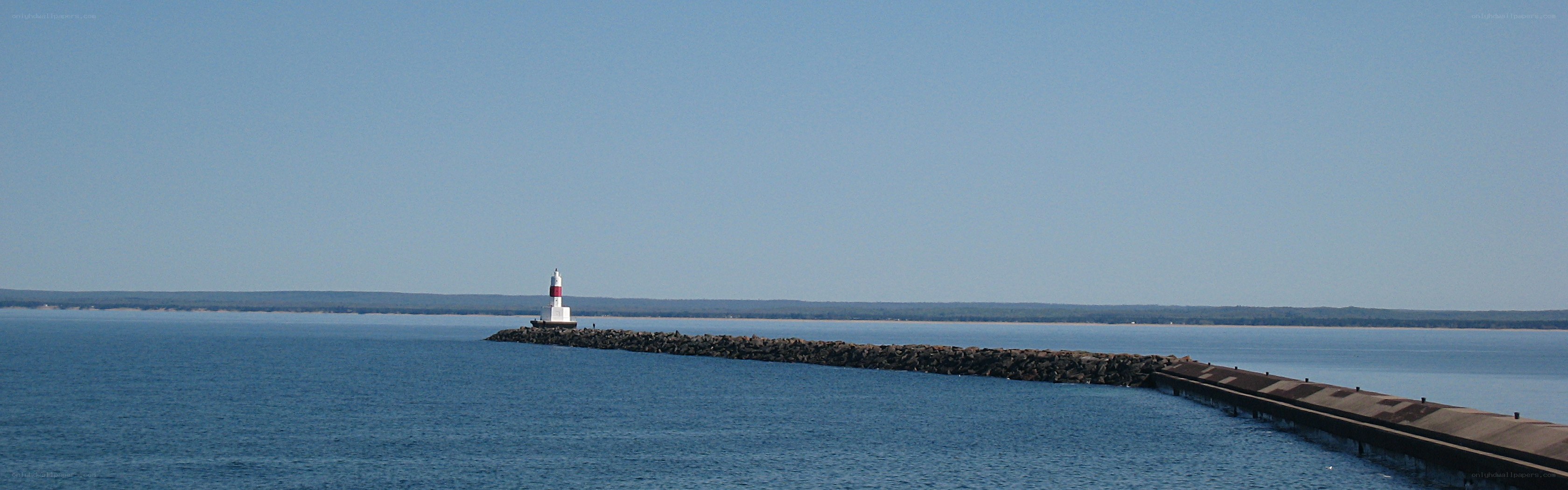 lighthouse on a rocky jetty