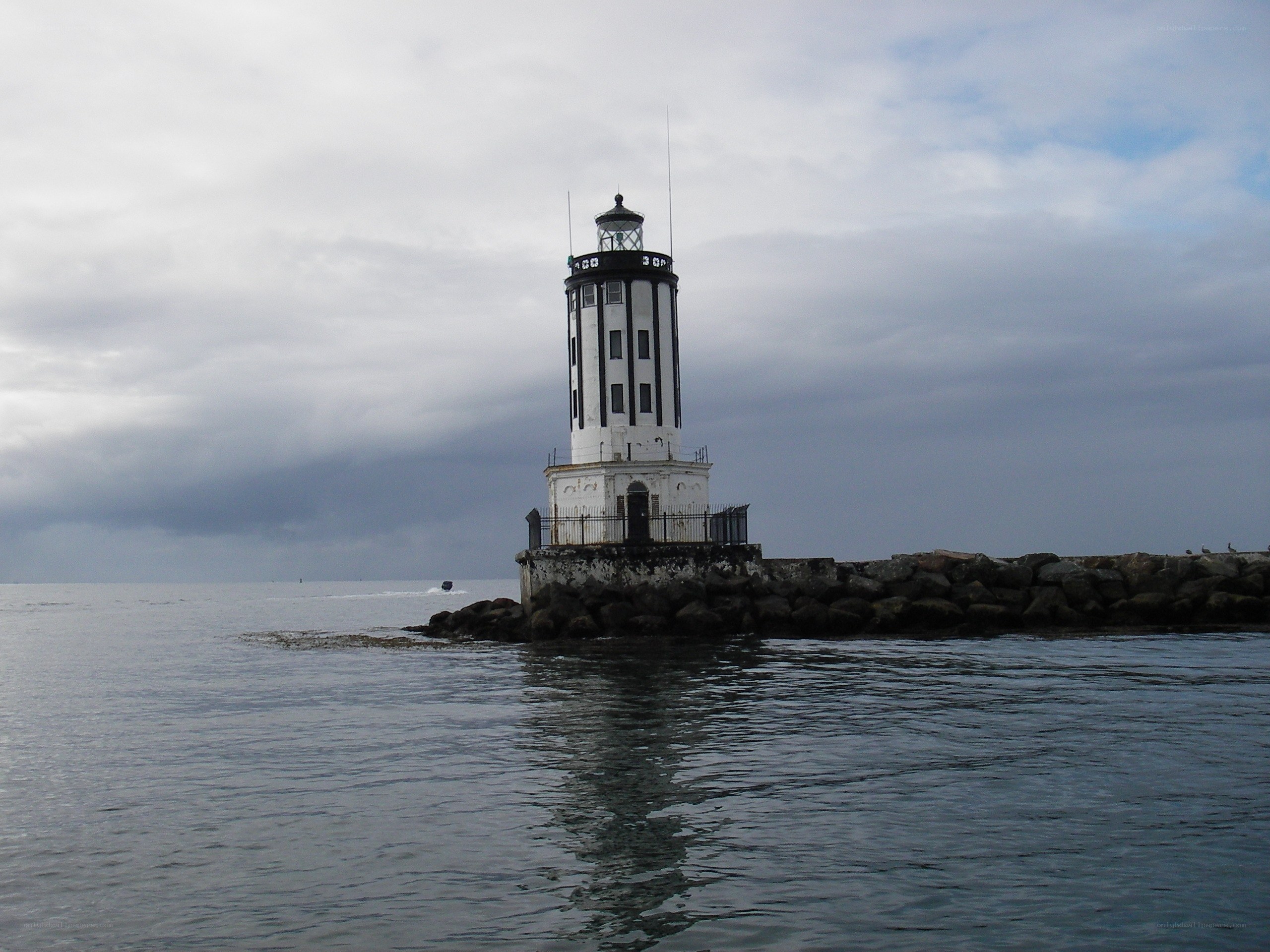 lighthouse on a rocky pier