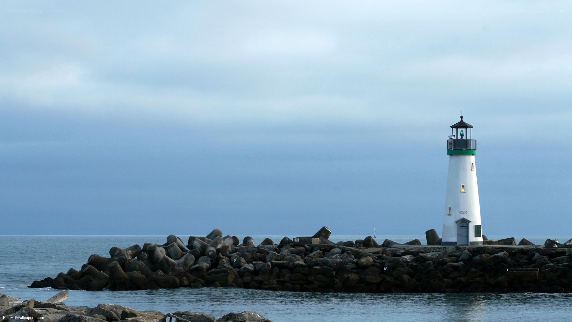lighthouse on a rocky pier