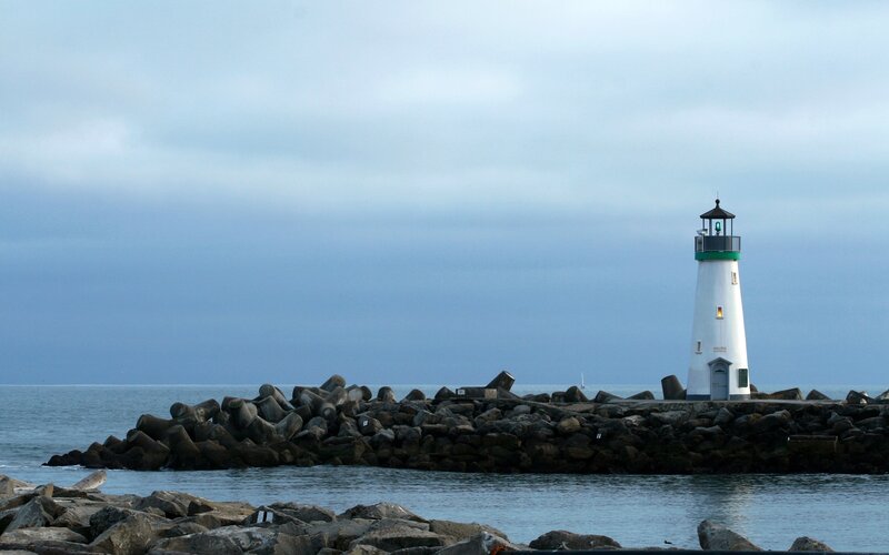 lighthouse on a rocky pier