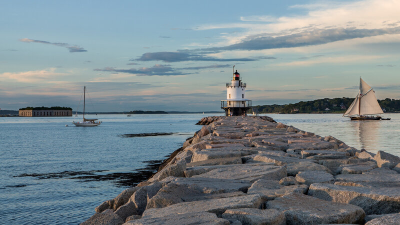 Lighthouse on a Rocky Pier — Blue