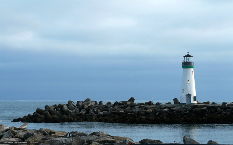 lighthouse on a rocky pier