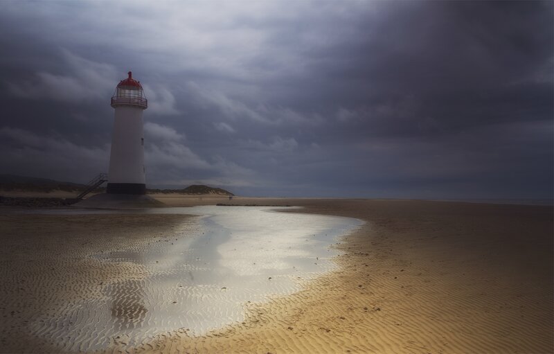 Lighthouse on a stormy beach