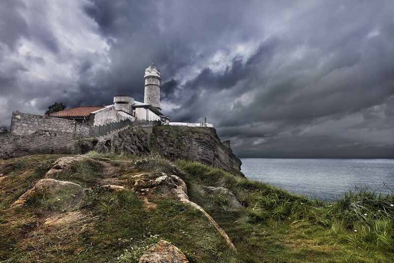 Lighthouse on a stormy cliff