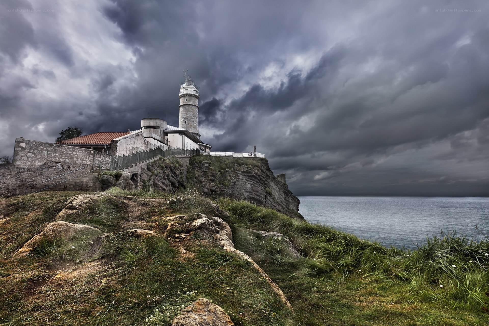 Lighthouse on a stormy cliff