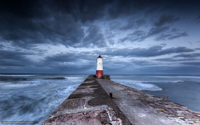 Lighthouse on a stormy pier