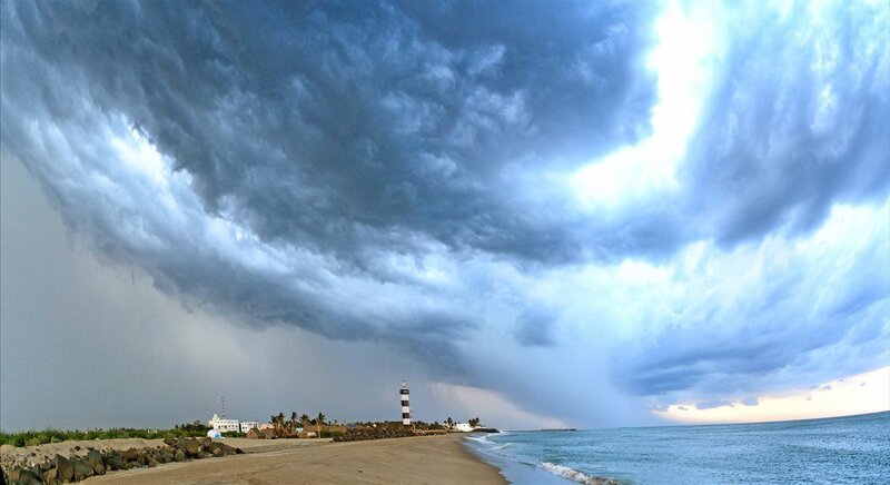 Lighthouse on Beach — Blue, Dramatic, Afternoon, Photograph