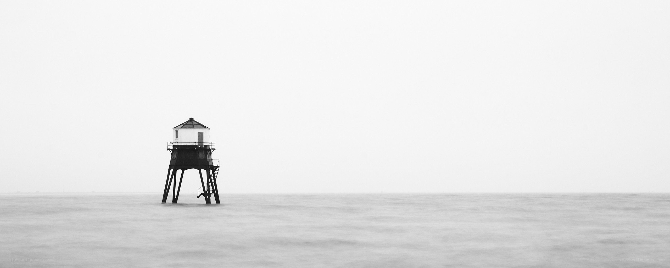 lighthouse on calm sea