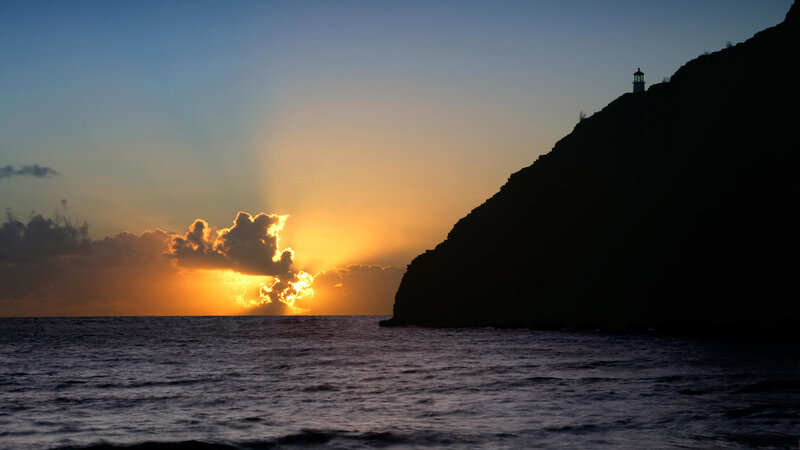 Lighthouse on Cliff at Sunset
