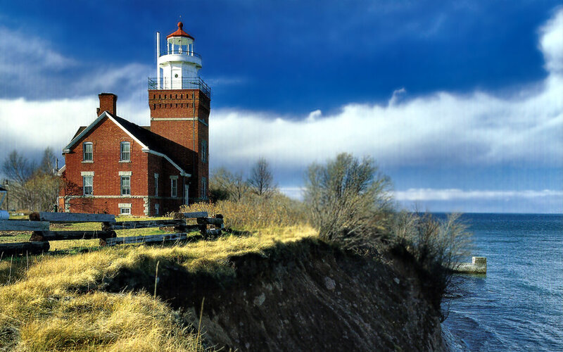 Lighthouse on Cliff — Blue, Dramatic, Afternoon, Photograph, Brick Building