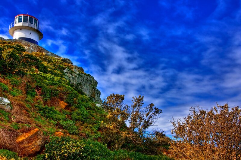 Lighthouse on Cliff — Blue, Dramatic, Afternoon, Photograph, Sky
