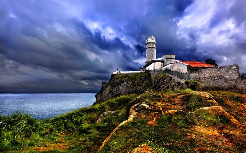 Lighthouse on Cliff — Blue, Dramatic, Photograph