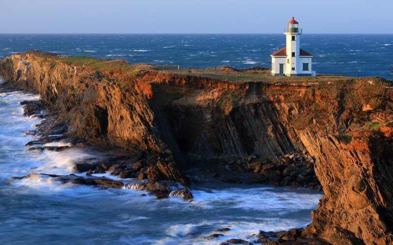 Lighthouse on Cliff — Blue, Dramatic, Sunset, Photograph, Ocean, Cliffs