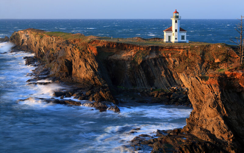 Lighthouse on Cliff — Blue, Dramatic, Sunset, Photograph, Ocean, Cliffs, Waves