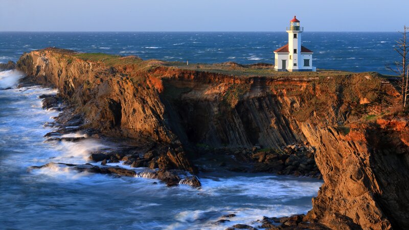 Lighthouse on Cliff — Blue, Dramatic, Sunset, Photograph, Ocean, Tree