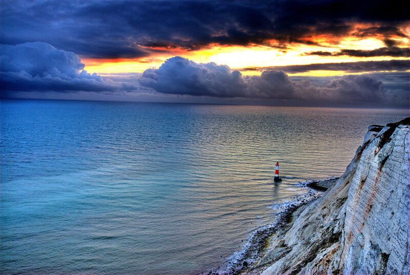 Lighthouse on Cliff — Blue, Dramatic, Sunset, Photograph, Sea