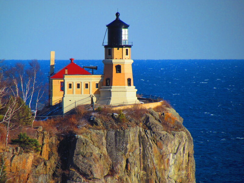 Lighthouse on Cliff — Blue, Serene, Afternoon, Photograph, Ocean, Trees